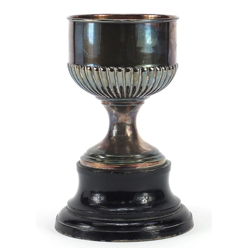 2268 - Spanish silver equestrian interest trophy raised on an ebonised wood base, 17.5cm high, total weight... 