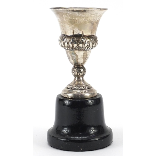 2255 - Spanish silver equestrian interest trophy raised on an ebonised wood base, 20cm high, total weight 2... 