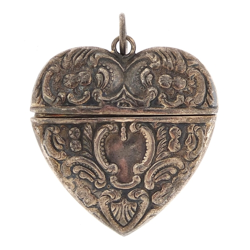 2275 - Silver love heart pendant with hinged lid having embossed decoration, L T maker's mark,  3.5cm high,... 