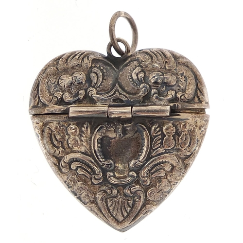 2275 - Silver love heart pendant with hinged lid having embossed decoration, L T maker's mark,  3.5cm high,... 