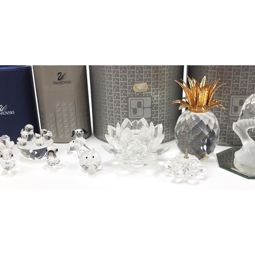 551 - Collection of Swarovski Crystal animals, flowers and candleholders, some with boxes, the largest 10c... 