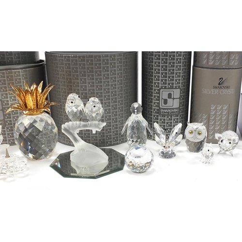 551 - Collection of Swarovski Crystal animals, flowers and candleholders, some with boxes, the largest 10c... 