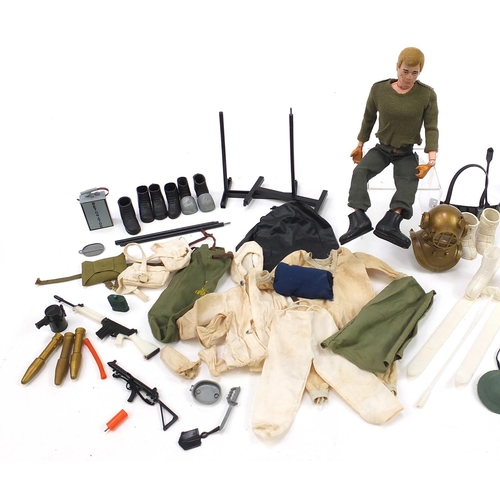 1500 - Vintage Action Man figure with a collection of weapons and accessories, 29cm high