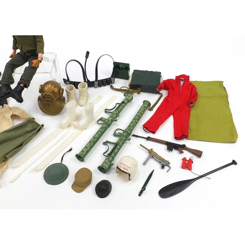 1500 - Vintage Action Man figure with a collection of weapons and accessories, 29cm high