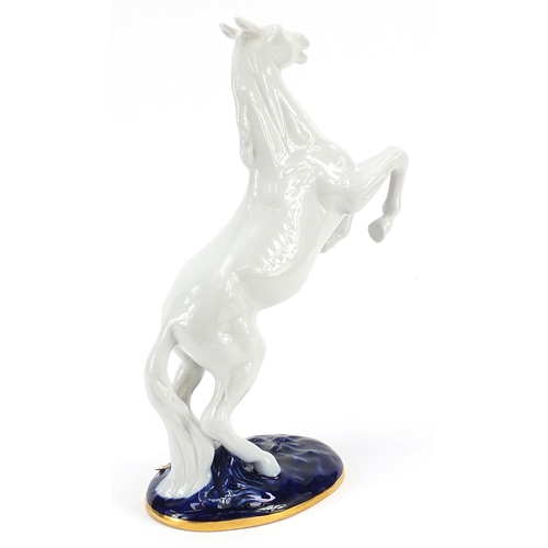 230 - Royal Dux, Czech rearing horse with paper label, 30cm high