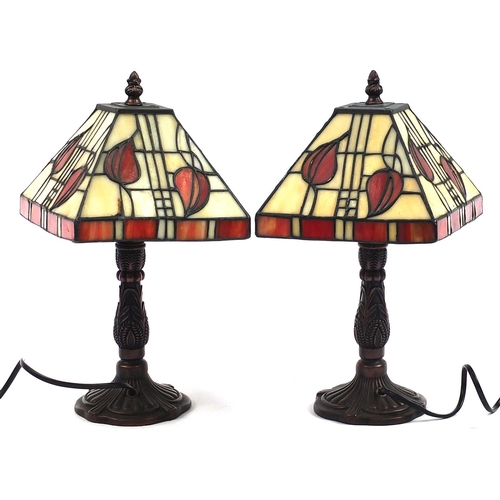 644 - Pair of Tiffany design bronzed table lamps with leaded glass shades, 24.5cm high