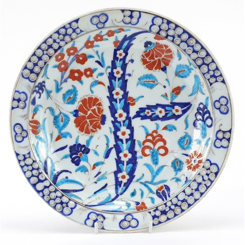 170 - Turkish Iznik pottery plate hand painted with flowers, 31cm in diameter