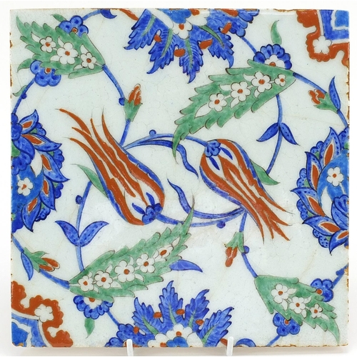 67 - Turkish Iznik pottery tile hand painted with flowers, 25cm x 25cm