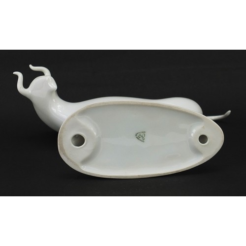 369 - Karlovarsky, Czech porcelain model of a stylised bull, 18.5cm in length