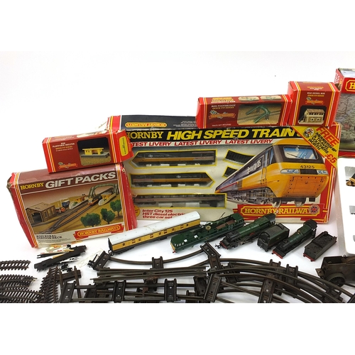 1059 - Model railway train sets, track and accessories including Tri-ang locomotive and Hornby