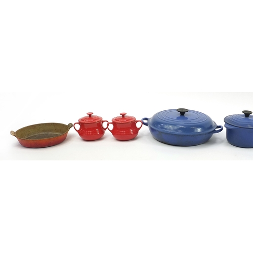 1022 - Group of vintage Le Creuset cast iron and stoneware pans and saucepans, the largest 37cm wide