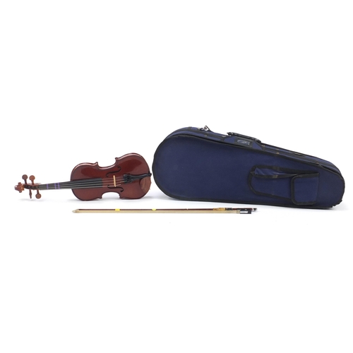 1062 - Stentor Student 1 child's violin with bow and protective case, the violin back 25cm in length