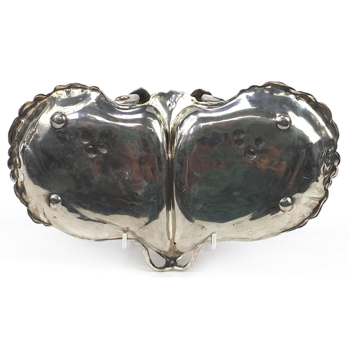 233 - WMF, German Art Nouveau pewter swing meat dish with handle in the form of a nude female, 31cm wide