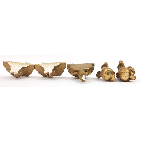 1382 - Three gilt Putti shelf brackets and pair of seated Putti figures, the largest 31cm high