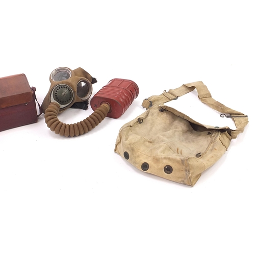 1572 - Militaria including gas mask with cartridges and can of Special Ration type C