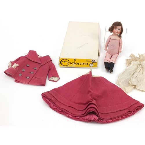 1478 - German bisque headed doll and a Victorian child's outfit with leather shoes, the doll 27cm high