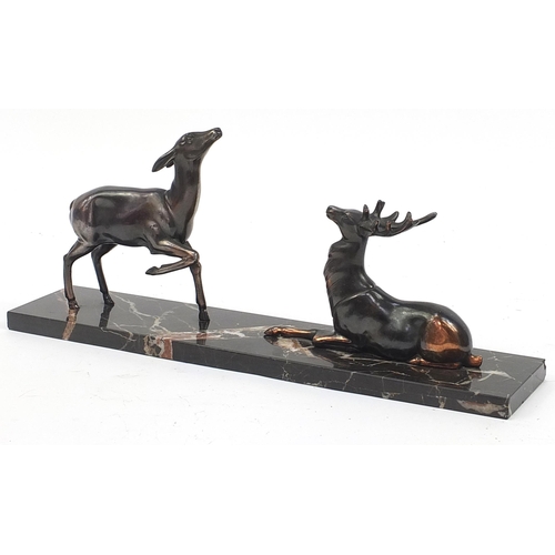 640 - Art Deco patinated spelter group of deer on a marble base, 47.5cm in length