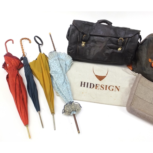 1132 - Vintage and later bags, holdalls and parasols including a Bric's leather bag