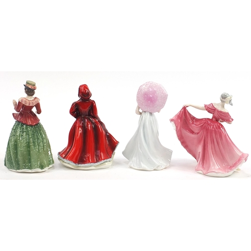 545 - Three Royal Doulton figurines comprising Elaine HN3307, Rachel HN2936, Holly HN3647 and a Coalport f... 