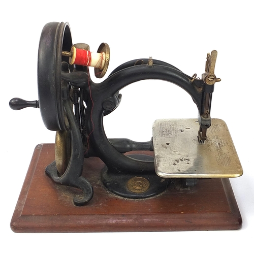 1037 - Two Victorian sewing machines comprising Willcox & Gibbs and Singer, the largest 44cm in length