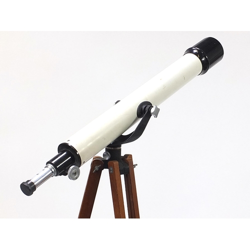 1053 - Unnamed telescope mounted on a military style adjustable tripod stand