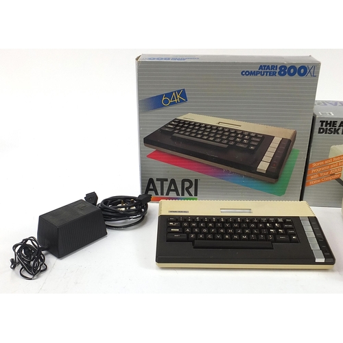 1493 - Atari 800XL computer and 1050 disc drive with boxes