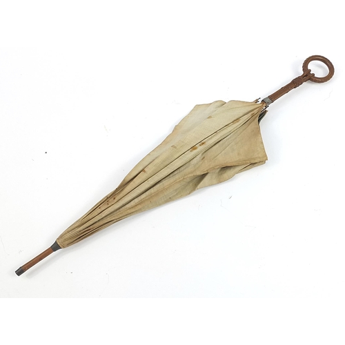 505 - Black forest parasol with carved bamboo design handle, 87cm in length