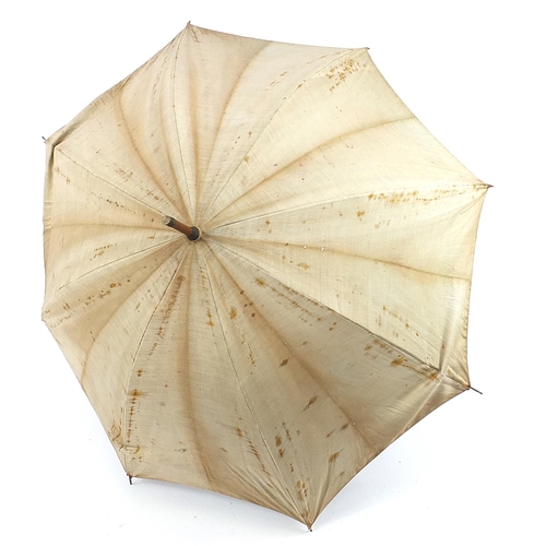 505 - Black forest parasol with carved bamboo design handle, 87cm in length