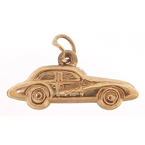 2093 - 9ct gold car charm, 2.1cm wide, 0.6g