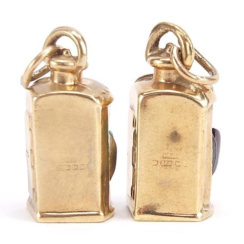 1893 - Two 9ct gold lantern charms set with green and red stones, each 1.9cm high, 3.0g