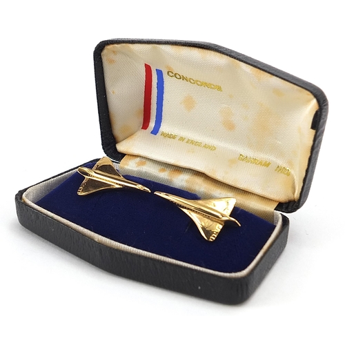 709 - Pair of gilt metal Concorde cufflinks with box, 2.9cm wide