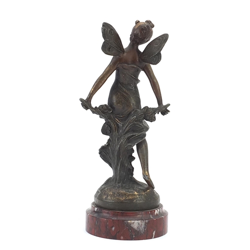 717 - French patinated bronze figure of a fairy raised on a marble base, the plaque inscribed La Prairie, ... 