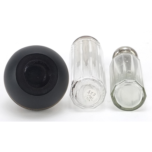 485 - Globular black glass scent bottle with 9ct gold mounts and two clear glass scent bottles, one with s... 