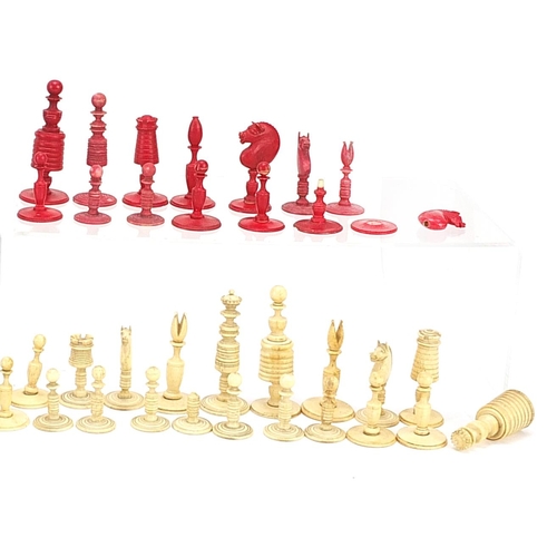 1476 - Collection of 19th century bone chess pieces, some stained, the largest pieces 8cm high