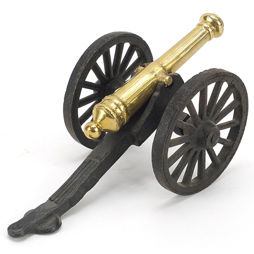 764 - Naval interest cast iron and brass model cannon, 20cm in length