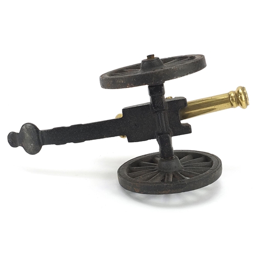 764 - Naval interest cast iron and brass model cannon, 20cm in length