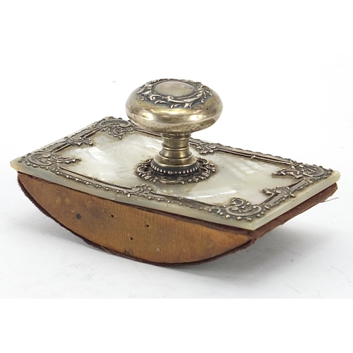 123 - Continental mother of pearl ink blotter with unmarked silver mounts, 9.5cm in length