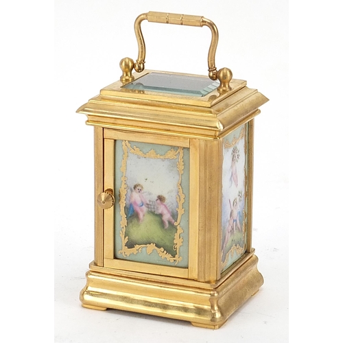 785 - Miniature brass cased carriage clock with Sevres style panels, 9.5cm high