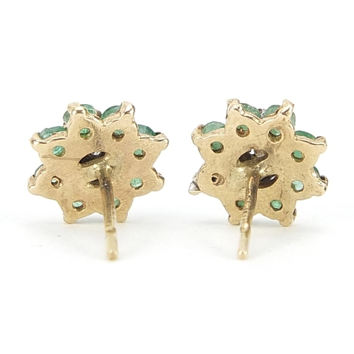 1717 - Pair of 9ct gold diamond and emerald flower head stud earrings, 1.0cm in diameter, 1.9g