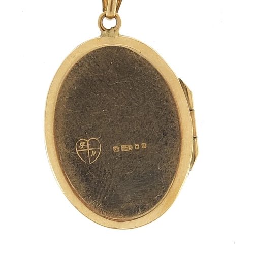 1864 - 9ct gold oval locket with engraved decoration on a 9ct gold rope twist necklace, 3.1cm high and 42cm... 