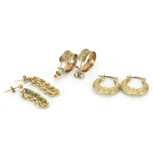 2074 - Three pairs of 9ct gold and yellow metal earrings including a rope twist example, the largest 2.8cm ... 