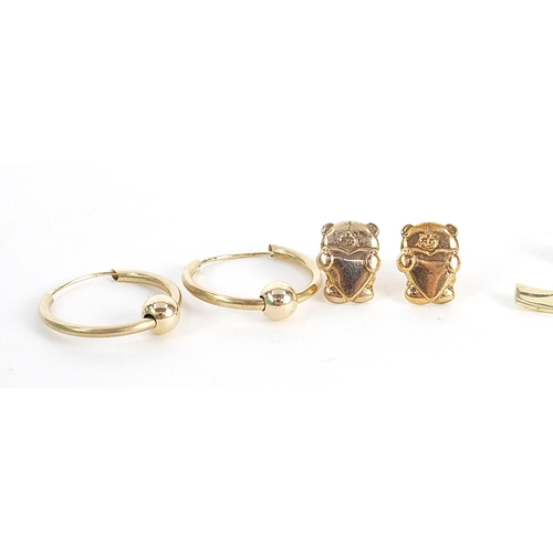 2040 - Four pairs of 9ct gold and yellow metal earrings including a pair of teddy bear stud earrings, the l... 