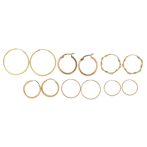 1962 - Six pairs of 9ct gold and yellow metal hoop earrings, the largest 2.4cm in diameter, 3.7g