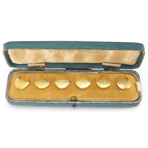 2069 - Set of six 18ct gold and mother of pearl dress studs housed in a fitted case, each 1.4cm in diameter... 