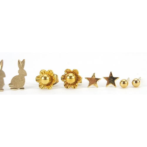 2131 - Five pairs of 9ct gold and yellow metal earrings including a 9ct gold flower head stud pair, the lar... 