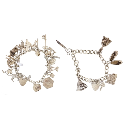 1788 - Two silver charm bracelets with a selection of mostly silver charms including koala, key and opening... 