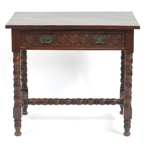 851 - Oak side table with bobbin turned legs, H stretches and frieze drawer carved with Tudor roses, 70cm ... 