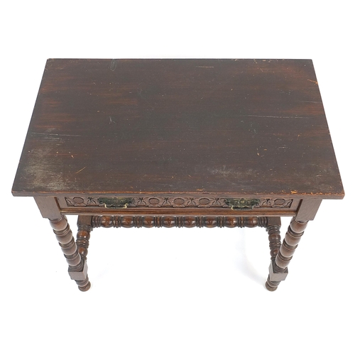 851 - Oak side table with bobbin turned legs, H stretches and frieze drawer carved with Tudor roses, 70cm ... 