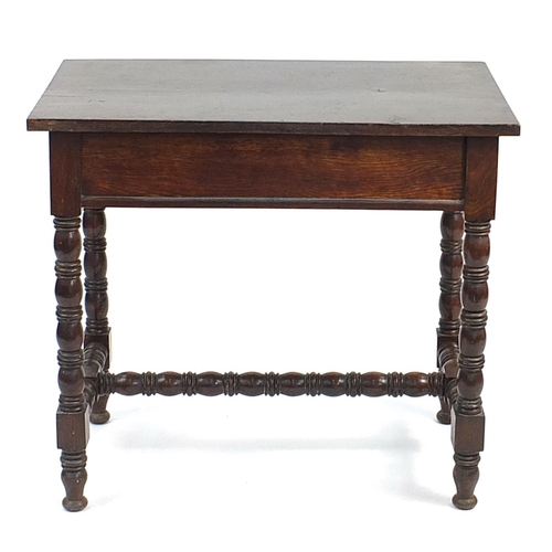 851 - Oak side table with bobbin turned legs, H stretches and frieze drawer carved with Tudor roses, 70cm ... 