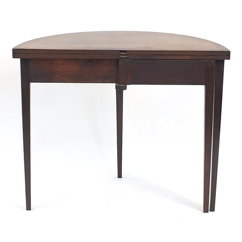 876 - Edwardian inlaid mahogany demi lune fold over card table with baize lined interior on tapering legs,... 